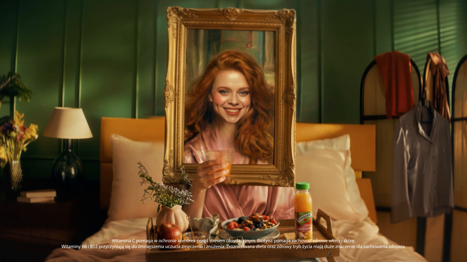 A woman appears inside a picture frame in the Tymbark campaign